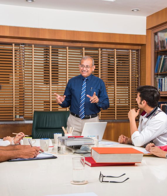asian-indian-business-people-corporate-culture-working-office-concept-with-laptop-papers-meetings-presentations-discussions-2-scaled